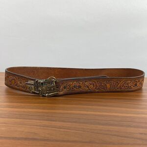 Vintage brown leather hand tooled Western belt.